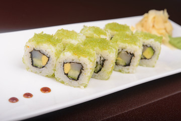 Sushi rolls on a white plate
