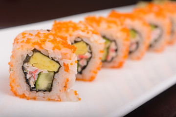 Sushi rolls on a white plate