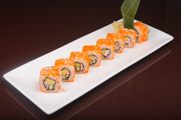 Sushi rolls on a white plate
