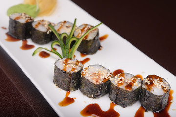 Sushi rolls on a white plate