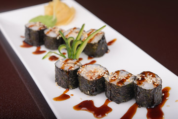 Sushi rolls on a white plate