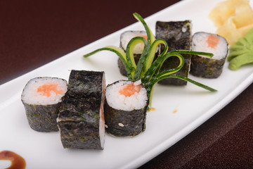 Sushi rolls on a white plate