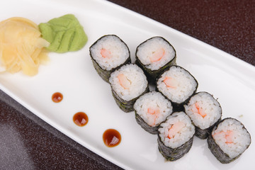 Sushi rolls on a white plate