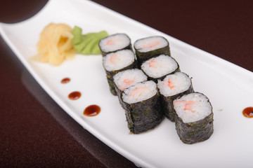 Sushi rolls on a white plate