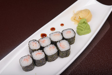 Sushi rolls on a white plate