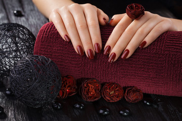 red manicure with rose flowers. spa