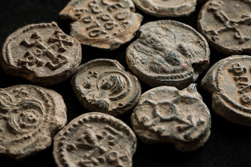 Pile of ancient post seals on black background