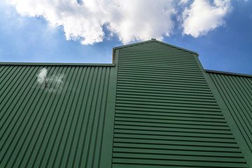 Fototapeta na wymiar Warehouse exterior on a blue sky