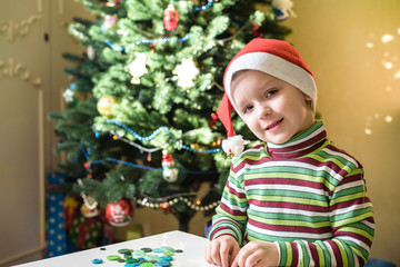 Kid child boy making by hands x-mas decorations