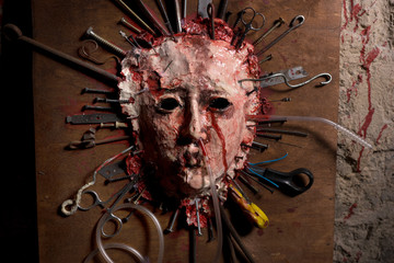 Close up of a skinned bloody face of a person stretched open on