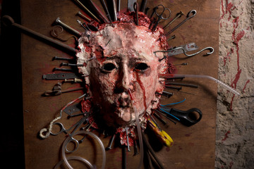 Close up of a skinned bloody face of a person stretched open on © kolotype