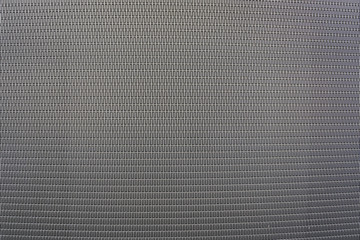 Background sheet of metal covered with abstract lines and holes