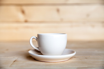 Cup of coffee on wooden table