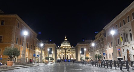 Fototapeta na wymiar View of Illuminated Saint Peter`s Basilica and Street Via della Conciliazione in the night, Rome, Italy 