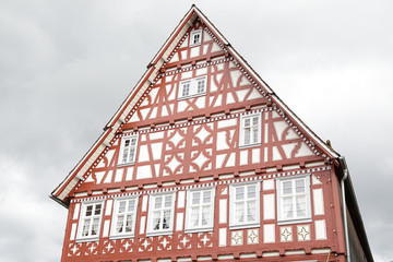 Facade of one traditional half-timbered house in a rainy day located in Dornstetten, Black Forest, Baden-Wuerttemberg, Germany