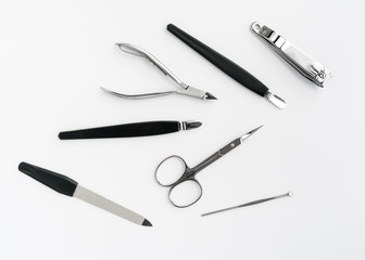 manicure instruments set on white background top view