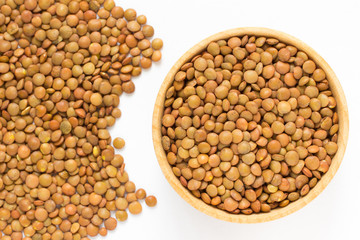  Brown lentils in a wooden bowl