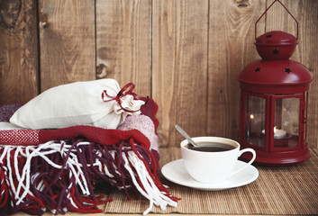 cup of coffee and a candle on a wooden table
