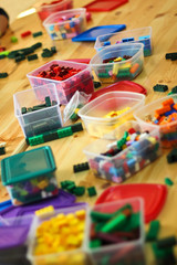 Macro view of heap of color plastic toy bricks. Selective focus effect
