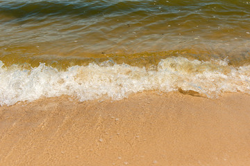 Summer vacation at the beach. Golden sand. Tidal bore.