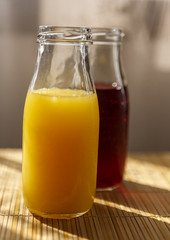 Orange and pomegranate juice in a jar mug