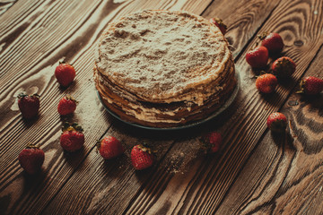 Cake of  pancakes,top view  dark brown wooden background, rustic