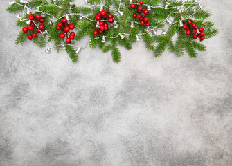 Naklejka na ściany i meble Christmas tree branches red berries Holidays decoration