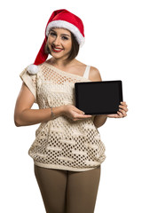 Christmas woman portrait holding tablet. Smiling happy girl over