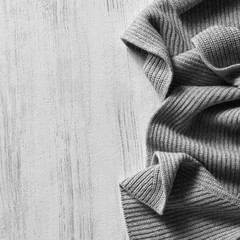 knitted sweater on old vintage wooden board