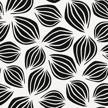Seamless pattern with hand drawn leaves in black on white background.