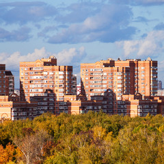 apartment houses in living urban quarter in autumn