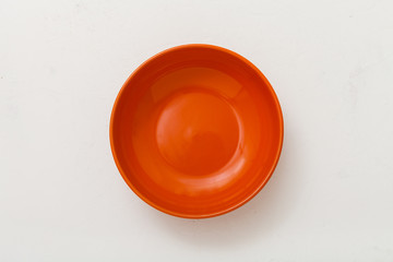 top view of orange bowl on plastering plate