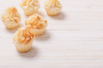 cakes on white wooden background