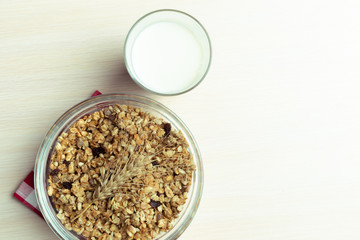 Glass of milk on table on blurred natural background