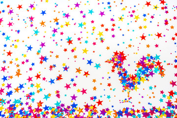 Multicolored asterisks scattered on a white background and the f