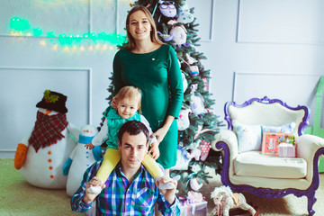 Obraz na płótnie Canvas young family celebrate Christmas together