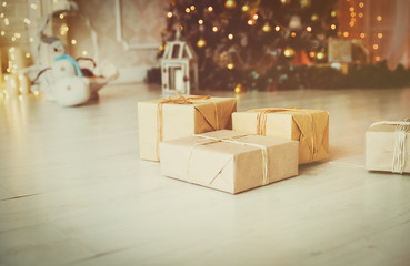 Christmas presents in living room under new year tree
