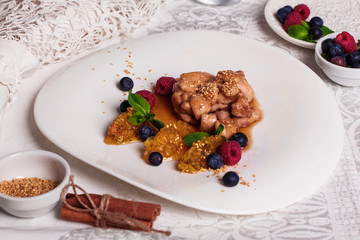 Chicken teriyaki sauce with raspberry and blueberry, quenelle of orange, natyumorort