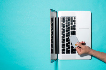 Top view of male hands making online payment
