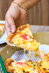 Slice of pizza margarita lifted up