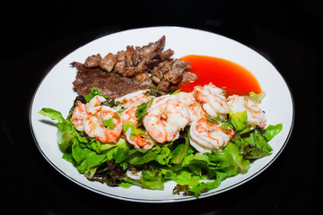 Grilled meat and shrimps with vegetables, barbecue grill food