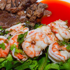 Grilled meat and shrimps with vegetables, barbecue grill food