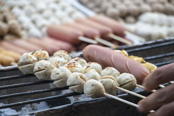 Street food in Thailand , meat ball grilled on barbecue stove