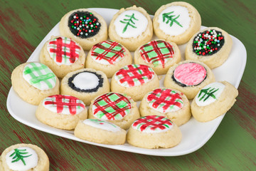 Christmas sugar cookies home painted with food color.