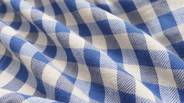 Modern shirt chequered pattern fabric texture close-up 4K 2160p 30fps UHD footage - Slow tilt over blue and white gingham check clothing cotton fine material3840X2160 UltraHD tilting video 