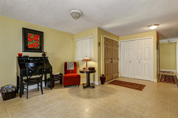 Entrance room interior with beige tile floor