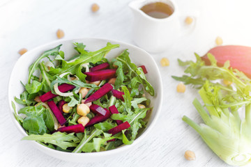 Fresh organic salad with chickpeas, beetroot and ruccola