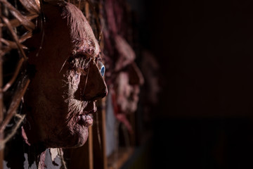 Close up of the dismembered ghastly faces stuck in square frames