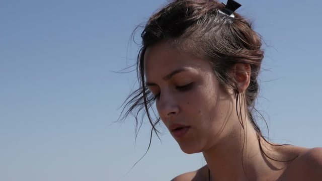 Slow motion attractive female enjoying sun and weather 1920X1080 HD footage - Young Caucasian brunette woman playing with soap bubbles outdoor slow-mo 1080p FullHD video 