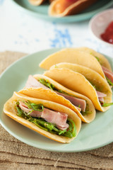 pancake with ham and seaweed in plate
